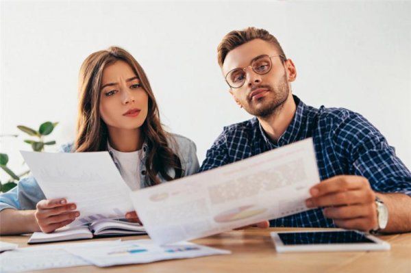 a man and a woman reviewing documents